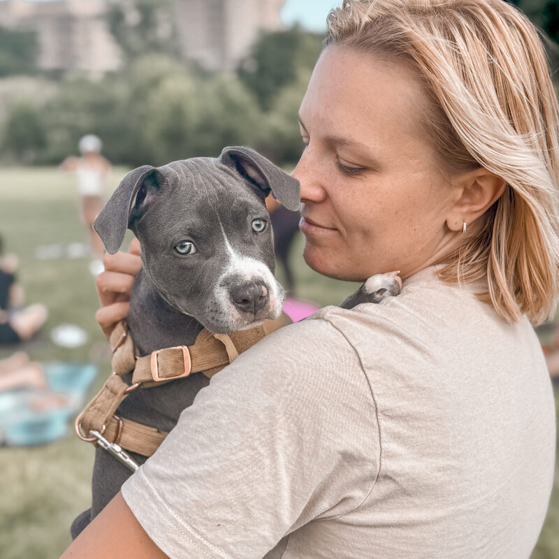 Annie, Founder & Executive Director of Detroit Hearts & Hounds, with a shelter dog